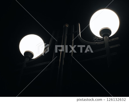 Street lights close-up at night. modern street lamp on a city street at night Street lights close-up at night. modern street lamp on a city street at night 126132632