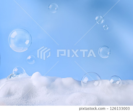Bubbles with soap Foam Against a Soft and Calming Blue Background 126133003