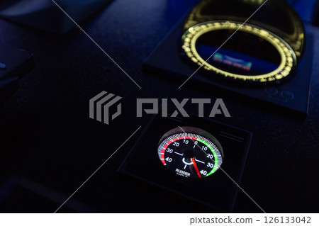 High-tech ship navigation bridge control panel with rudder angle indicator High-tech ship navigation bridge control panel with rudder angle indicator 126133042