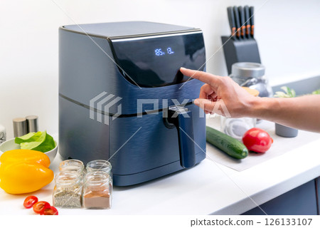 Air fryer machine in the kitchen 126133107