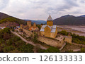 Aerial top view of Ananuri Fortress Complex on Aragvi River. Castle with old medieval orthodox church is tourist attraction. Georgian monastery at bank of Zinvali reservoir. Tbilisi, Georgia, Europe, 126133333