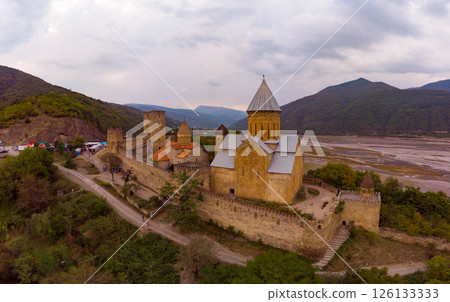 Aerial top view of Ananuri Fortress Complex on Aragvi River. Castle with old medieval orthodox church is tourist attraction. Georgian monastery at bank of Zinvali reservoir. Tbilisi, Georgia, Europe, Aerial top view of Ananuri Fortress Complex on Aragvi River. Castle with old medieval orthodox church is tourist attraction. Georgian monastery at bank of Zinvali reservoir. Tbilisi, Georgia, Europe, 126133333