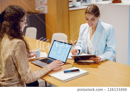 Professional Business Meeting Taking Place in a Modern Office Setting Configuration 126133890