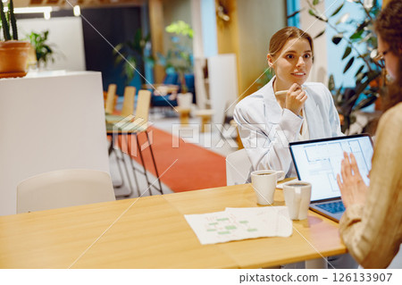 A Business Meeting Concept Held in a Modern Office Environment With an Emphasis on Collaboration 126133907