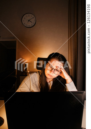 Tired new entrepreneur trying to deal with business problems. Upset businesswoman feeling tired of unsuccess selling products. Woman with laptop. Online business concept. 126134198