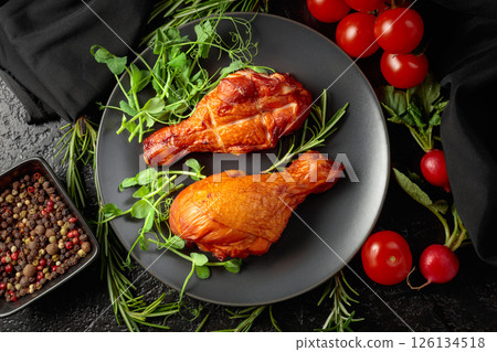 Smoked chicken drumsticks with greens and vegetables. Smoked chicken drumsticks with greens and vegetables. 126134518