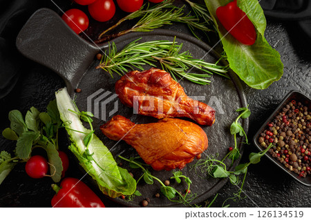 Smoked chicken drumsticks with greens and vegetables. Smoked chicken drumsticks with greens and vegetables. 126134519