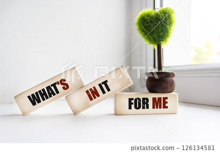 WHAT'S IN IT FOR ME text on wooden blocks and vintage background WHAT'S IN IT FOR ME text on wooden blocks and vintage background 126134581