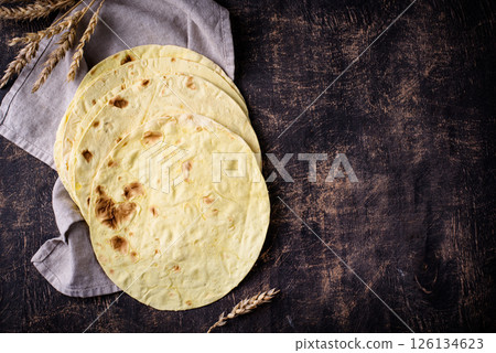 Lavash flat bread on green background Lavash flat bread on green background 126134623