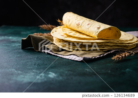 Lavash flat bread on green background Lavash flat bread on green background 126134689