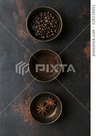 Coffee Beans, Grounds, and Star Anise in Rustic Bowls 126134951
