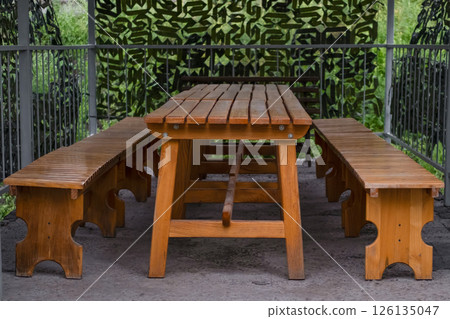 wooden table benches close up wooden table benches close up 126135047