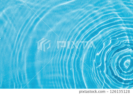 drops on water with circles on a blue background drops on water with circles on a blue background 126135128