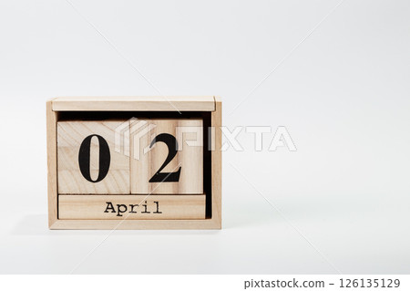 Wooden calendar April 02 on a white background Wooden calendar April 02 on a white background 126135129