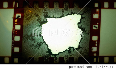 Decayed film frame with chemical damage and light leak 126136054