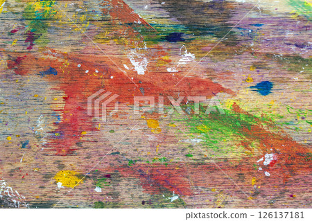 Color splashed wooden palette with layers of acrylic paint, scratches and artistic brush strokes. Concept of painting, creativity and studio process Color splashed wooden palette with layers of acrylic paint, scratches and artistic brush strokes. Concept of painting, creativity and studio process 126137181