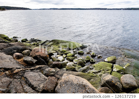Beautiful lakeside view from a small lake in Sweden. Beautiful lakeside view from a small lake in Sweden. 126137259