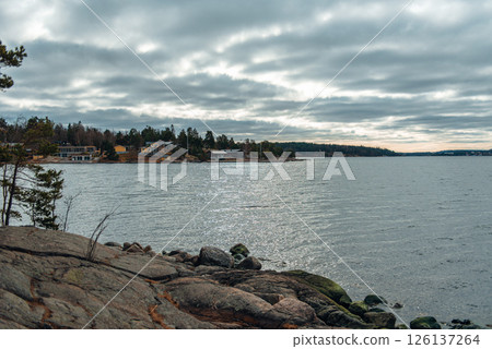 Beautiful lakeside view from a small lake in Sweden. Beautiful lakeside view from a small lake in Sweden. 126137264