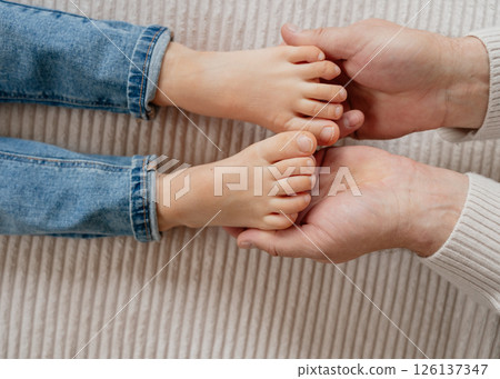 baby feet, boy feet, foot massage, dad tickles son's feet, foot tickling . High quality photo baby feet, boy feet, foot massage, dad tickles son's feet, foot tickling . High quality photo 126137347