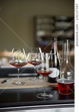 Decanter for sparkling wine on the table, Champagne tasting, Wine glasses and bottle, reflections, rose wine 126137387