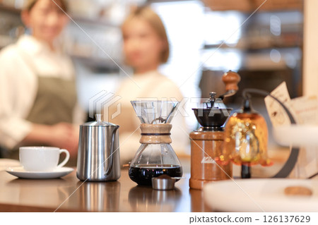 Coffee and two baristas 126137629