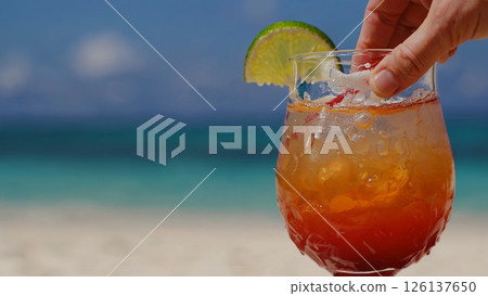 Chilled cocktail decorated with cherry, resting on sandy shore with turquoise waters, tropical scene capturing summer vacation leisure and relaxation moment Chilled cocktail decorated with cherry, resting on sandy shore with turquoise waters, tropical scene capturing summer vacation leisure and relaxation moment 126137650