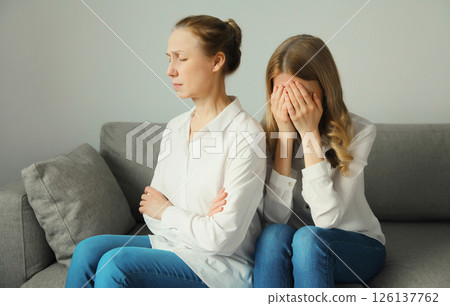 Upset offended caucasian two women, mature mother or sister and adult daughter together at home 126137762