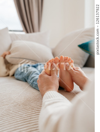 baby feet, boy feet, foot massage, dad tickles son's feet, foot tickling . High quality photo 126137922