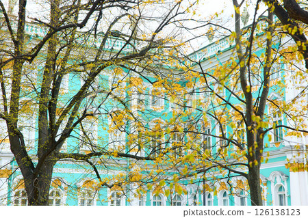 the incredibly picturesque facade of the Winter Palace through the branches of trees on a clear spring day, the heritage of Russia, the most famous landmark of St. Petersburg, the museum the incredibly picturesque facade of the Winter Palace through the branches of trees on a clear spring day, the heritage of Russia, the most famous landmark of St. Petersburg, the museum 126138123