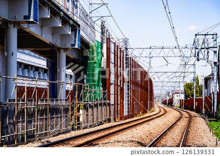 Railway viaduct construction and existing tracks Around Higashimurayama Station, Tokyo 2025.04 a-2 High saturation contrast 126139331