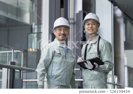 Two workers looking at the camera Building maintenance staff image 126139434