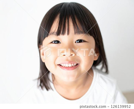 Japanese child looking up with a smile 126139952