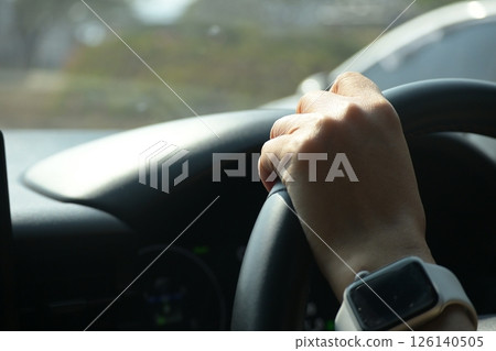 female driver hand hold steering wheel drive vehicle car rode trip travel female driver hand hold steering wheel drive vehicle car rode trip travel 126140505