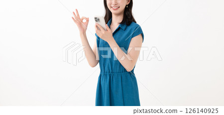 Woman holding a smartphone 126140925