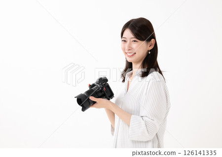 A woman with a camera 126141335