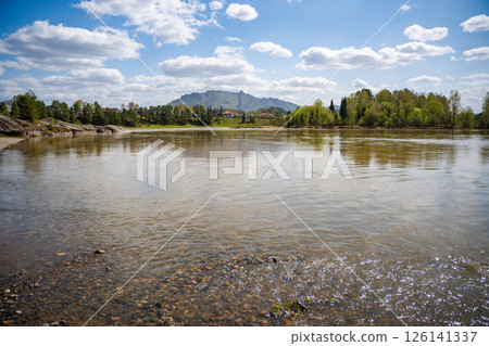 View of Love Stone over the Biya River with the town of Turochak on the opposite bank. Concept of serenity, connection, and sacred places in wild Russian nature 126141337