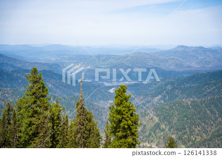 Panoramic view from Mount Kokuya at Teletskoye Ski Resort. Spring landscape with snow and mountains in Altai, Russia 126141338