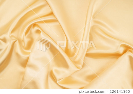 Light Yellow Silk Fabric Texture with Beautiful Waves. Elegant Background. 126141560