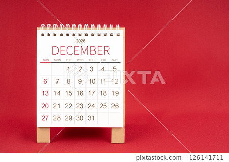 Blank desk calendar for December 2026 on red background. Blank desk calendar for December 2026 on red background. 126141711