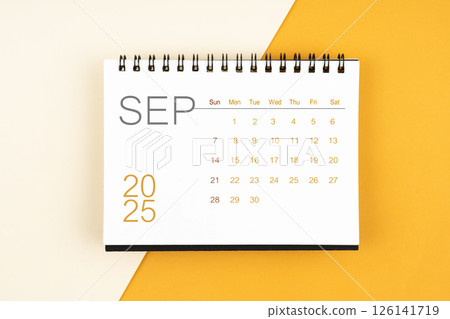 Desk calendar for September 2025 year on yellow background, Flat lay. Desk calendar for September 2025 year on yellow background, Flat lay. 126141719