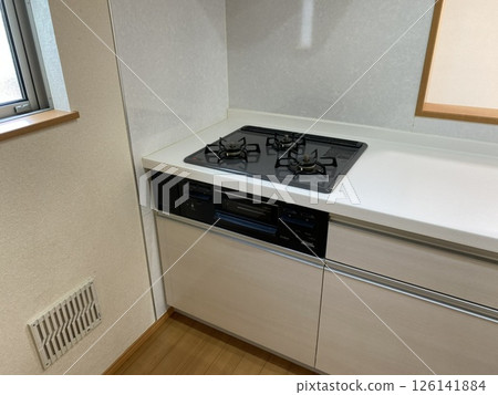 Kitchen with white walls and gas stove 126141884