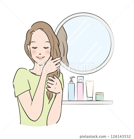 A woman with long hair carefully taking care of her hair 126143532