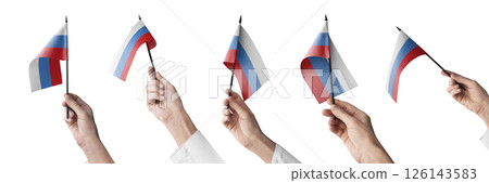 The Russia flag in hand in different angles on a white background 126143583