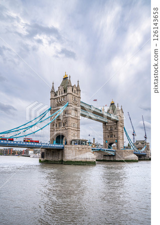 Tower Bridge Spans the Thames with Its Gothic Towers and Blue Cables, Remaining a Must-See Symbol of the City for Visitors in July 2023 Tower Bridge Spans the Thames with Its Gothic Towers and Blue Cables, Remaining a Must-See Symbol of the City for Visitors in July 2023 126143658
