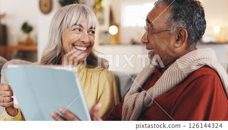 Home, tablet and senior couple with smile, love and conversation with retirement, app and social media. Internet, marriage and old man with elderly woman, tech and bonding together with entertainment 126144324