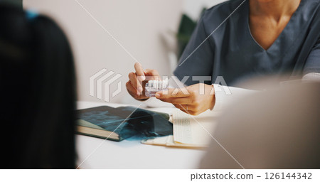 Hands, dentist and model in clinic advice for oral hygiene, teeth whitening and cleaning or checkup. People, discussion and orthodontist for tooth health, cavity search or plaque removal procedure 126144342