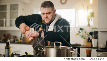 Man, chef and spices in kitchen for meal prep, seasoning and lunch or cooking. Recipe, salt and pepper and nutrition with food and gourmet skills at home for wellness, small business and grinder 126144344