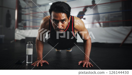 Man, push ups and boxer in gym for fitness, warm up or ready for training for match, strength and muscle. Serious, sports and boxing ring with athlete, start or prepare for performance with power Man, push ups and boxer in gym for fitness, warm up or ready for training for match, strength and muscle. Serious, sports and boxing ring with athlete, start or prepare for performance with power 126144430