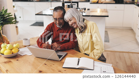 Elderly couple, laptop and finance in home with documents, results or smile with goal for pension. Interracial relationship, man and woman for investing, happy or email for retirement income in house 126144440