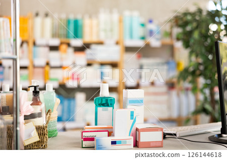 Various medicine and personal care products on pharmacy counter 126144618